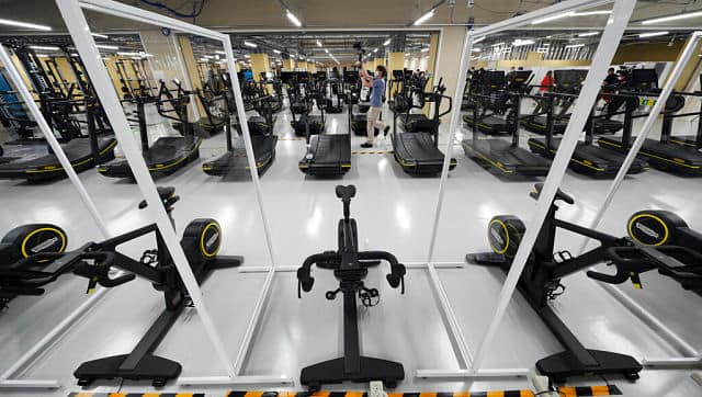 Plexiglass shields between gym equipment will be in place as part of the coronavirus measures. AP Photo