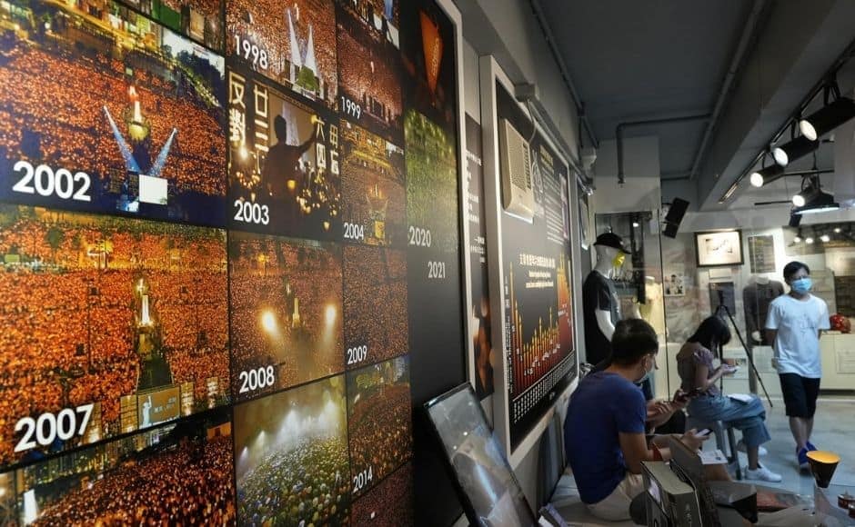 The organiser of Hong Kong’s annual Tiananmen Square candlelight vigil has opened its yearly exhibit of photographs and paraphernalia from the bloody 1989 crackdown in Beijing on those calling for democracy in China. | In the picture: Pictures for past years of people gathered during a candlelight vigil at Victoria Park are displayed at the "June 4 Memorial Museum" run by pro-democracy activists in Hong Kong on Sunday, 30 May, 2021. Photo via The Associated Press/Vincent Yu