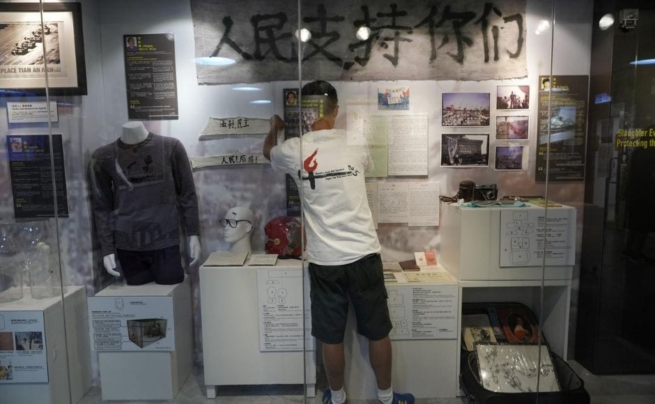 Authorities have cited the risk of the coronavirus, though the cancellation coincides with a broader crackdown on political activism and dissent in the city. | In the picture: A staff member adjusts exhibits at the "June 4 Memorial Museum" run by pro-democracy activists in Hong Kong on Sunday. Photo via The Associated Press/Vincent Yu