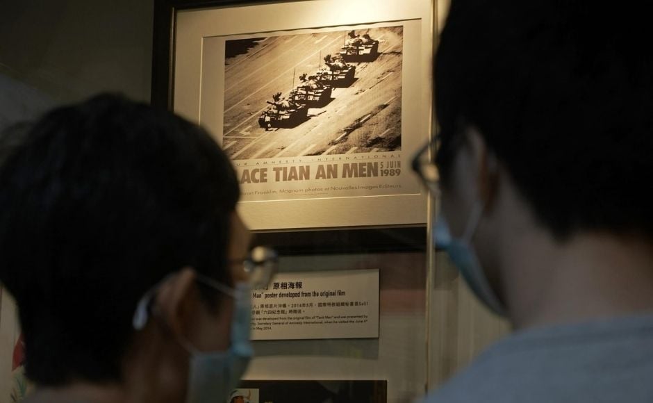 In the picture: A picture showing a man blocking a line of tanks at the 1989 pro-democracy movement in Beijing is displayed at the "June 4 Memorial Museum". Photo via The Associated Press/Vincent Yu