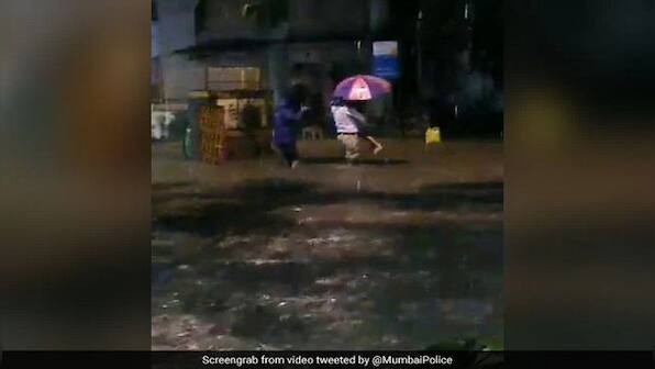 Watch: Heartwarming video of Mumbai policeman helping father and daughter to safety on flooded road