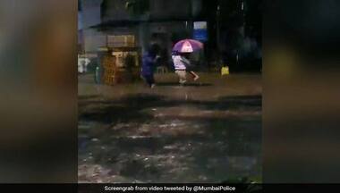 Watch: Heartwarming video of Mumbai policeman helping father and daughter to safety on flooded road