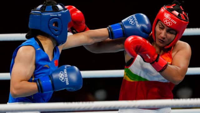 India’s Pooja Rani, right, exchanges punches with China’s Li Qian during their women’s middleweight 75-kg boxing match at the 2020 Summer Olympics. AP