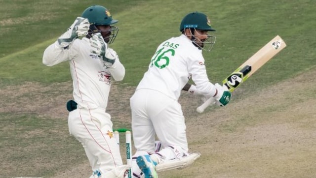 Bangladesh’s Liton Das (R) watches the ball after playing a shot as Zimbabwe’s Regis Chakabva (L) looks on during the first day of the Test cricket match between Zimbabwe and Bangladesh. AFP 
