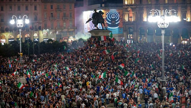 More pictures of Italy fans celebrating in Piazza Duomo in Milan, Italy on 11 July, 2021 after their team won the European Championship against England. AP