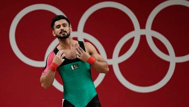 Talha Talib of Pakistan celebrates after a lift as he competes in the men’s 67kg weightlifting event. AP
