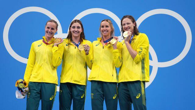 Australia's women's 4x100m women's relay team, Meg Harris, Bronte Campbell, Emma McKeon and Cate Campbell celebrate on the podium at the 2020 Summer Olympics, Sunday, July 25, 2021, in Tokyo, Japan. (AP Photo/Matthias Schrader)