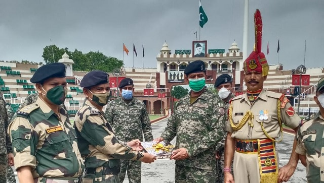 BSF, Pakistan rangers exchange sweets on Eid-ul-Adha for first time since Article 370 abrogation BSF, Pakistan rangers exchange sweets on Eid-ul-Adha for first time since Article 370 abrogation