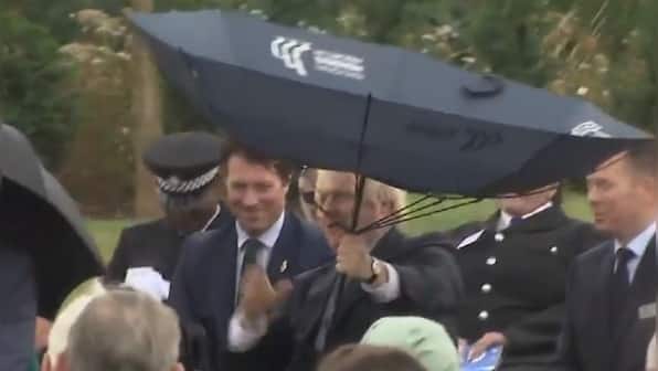Watch: Boris Johnson struggles with umbrella at memorial service for police; viral video prompts memes aplenty