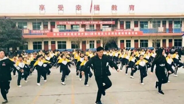 Watch: Chinese school principal breaks into 'shuffle dance' to get students into exercise routine