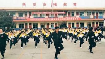 Watch: Chinese school principal breaks into 'shuffle dance' to get students into exercise routine