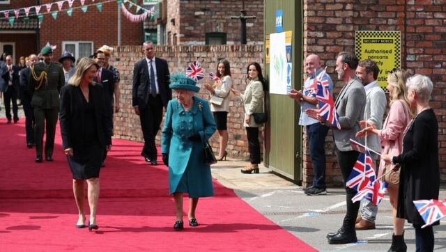 Queen Elizabeth visits sets of Coronation Street, world's longest-running television soap opera, to commemorate its 60th year