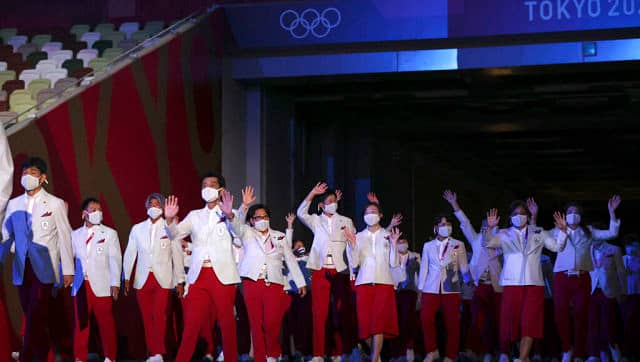 The hosting Japanese contingent make their appearance during the Olympics opening ceremony. AP 