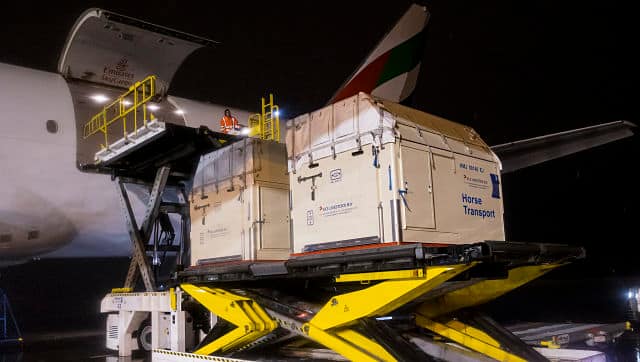 A horse stall is loaded into an airplane due to fly to Tokyo for the Olympics from Liege, Belgium. Image courtesy: FEI Flickr account/Leanjo de Koster