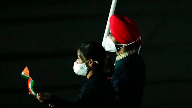 A close-up of Indian flag-holders Mary Kom and Manpreet Singh. AP 