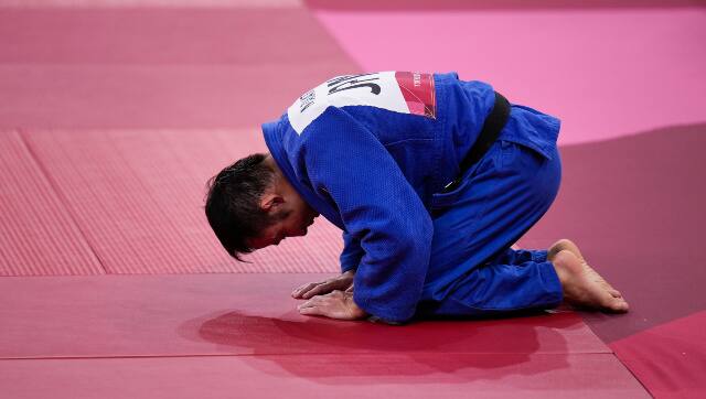 Naohisa Takato became Japan's first gold medallist after defeating Yang Yung-wei, of Taiwan in the men's 60kg judo final. AP