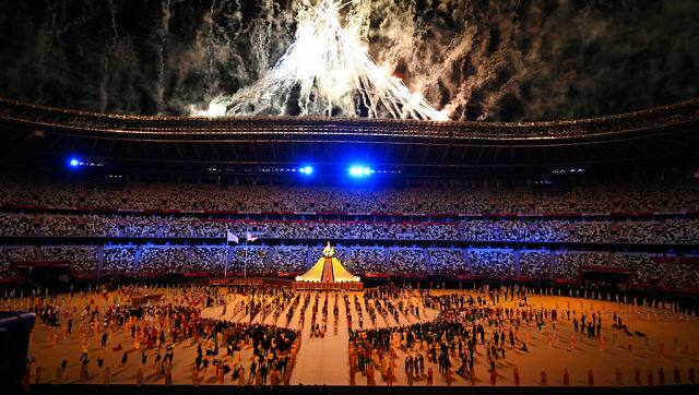 Fireworks are lit at the end of the Olympics opening ceremony, with the Olympic Cauldron flame also being lit. AP 