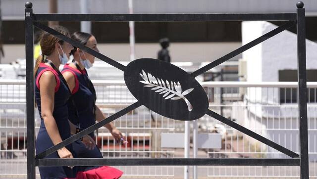 Festival employees walk past a Palme d’Or sign on a railing during preparations for the 74th international film festival, Cannes, southern France, July 5, 2021 (AP Photo)