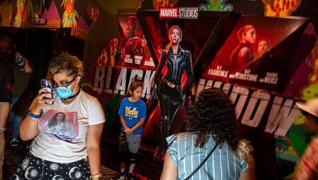 A moviegoer is glued to the small screen at the El Capitan theater in Los Angeles. Credit...Jay L. Clendenin/Los Angeles Times, via Getty Images