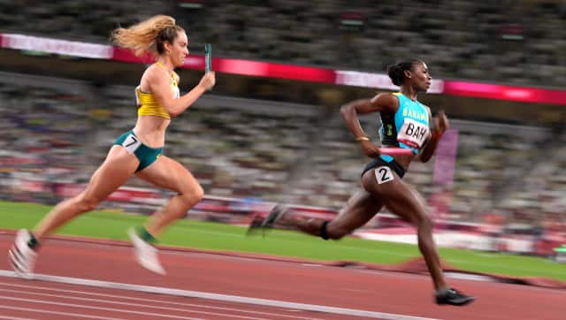 Doneisha Anderson of the Bahamas runs the lead leg in a semi-final of the women's 4 x 400-meter relay. AP