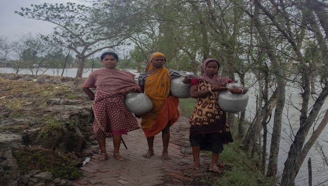 Many women travel almost two to three kilometres to fetch clean drinking water for their family, just to save them from water-borne diseases during the flood and monsoon. Image courtesy: Taniya Sarkar