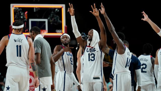The United States basketball team celebrates after beating Australia 97-78 in the men's basketball semi-final. AP