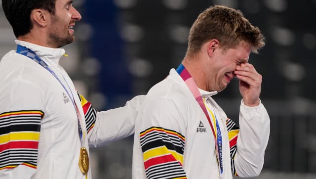 Belgium's Victor Nicky B Wegnez cries on the podium after his team beat Australia in the penalty shootout to win the men's hockey gold. AP
