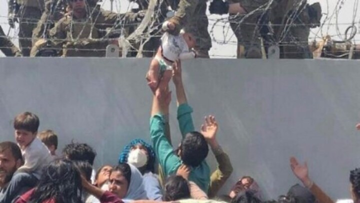 Afghan baby who was handed over to US troops at Kabul airport, reunited with father