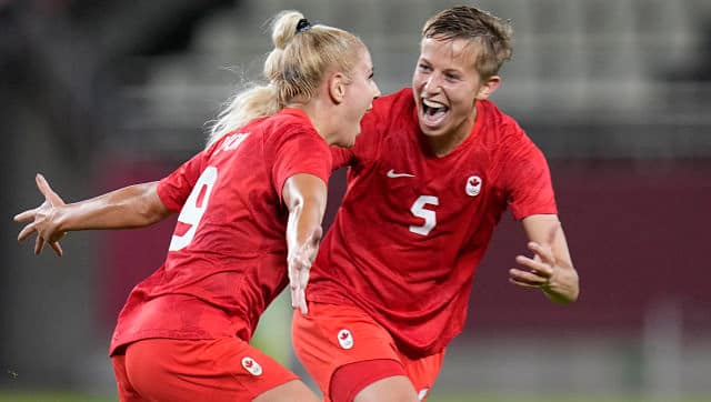 Canada’s Adriana Leon, left, celebrates with teammate Quinn. AP