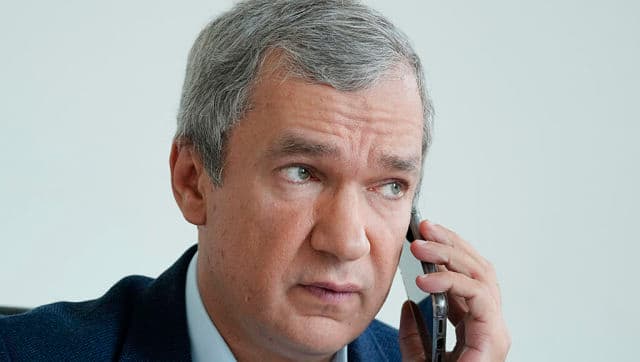 Top Belarusian dissident in Poland, Pavel Latushka, talks on the phone while he is trying to assist Belarusian Olympic sprinter Krystsina Tsimanouskaya in her plans to seek asylum in Poland. AP