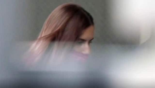 In this image made from video provided by NTV, Belarus Olympic sprinter Krystsina Tsimanouskaya enters the Polish embassy in Tokyo, Japan. NTV via AP