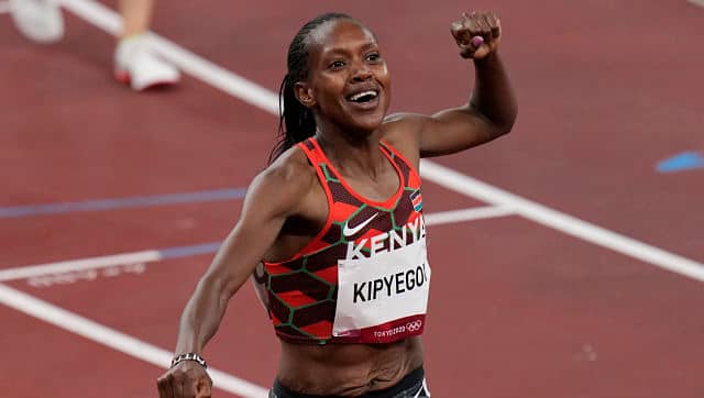 Faith Kipyegon, of Kenya celebrates after winning gold in the final of the women’s 1,500, at 2020 Summer Olympics. AP