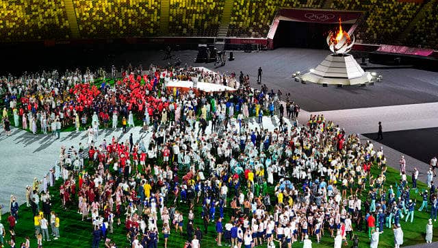 Athletes arrive for the closing ceremony in the Olympic Stadium at the 2020 Summer Olympics. AP Photo/Lee Jin-man