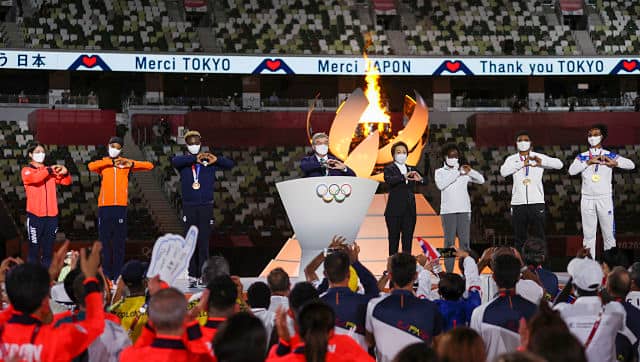 International Olympic Committee’s President Thomas Bach and Seiko Hashimoto, president of the Tokyo Organizing Committee of the Olympic and Paralympic Games make the sign of a heart with their hands during the closing ceremony in the Olympic Stadium. Dan Mullen/Pool Photo via AP