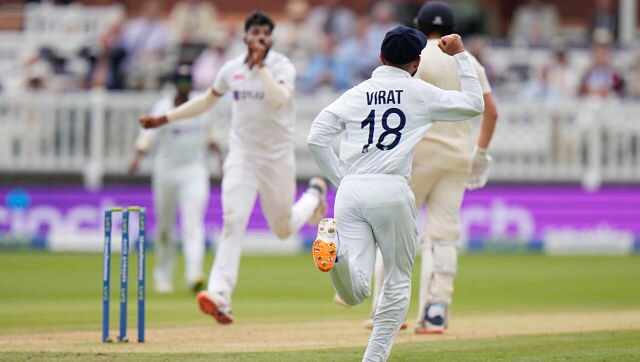 India’s Virat Kohli celebrates after tacking a catch to dismiss England’s Jonny Bairstow off the bowling of Mdohammed Siraj. AP