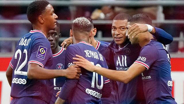 Paris Saint-Germain players celebrate after PSG’s Kylian Mbappe, second right, scored his goal against Reims. AP