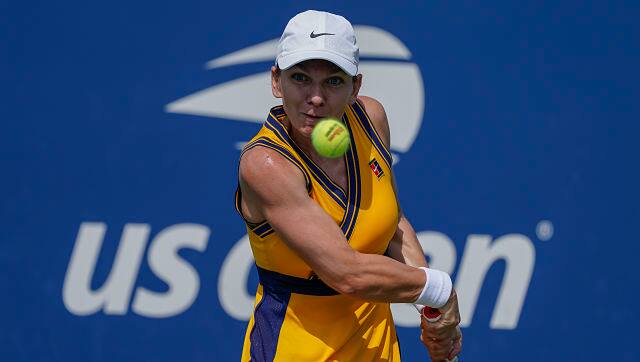 Simona Halep, of Romania, returns a shot to Camila Giorgi, of Italy, during the first round of the US Open tennis championships. AP