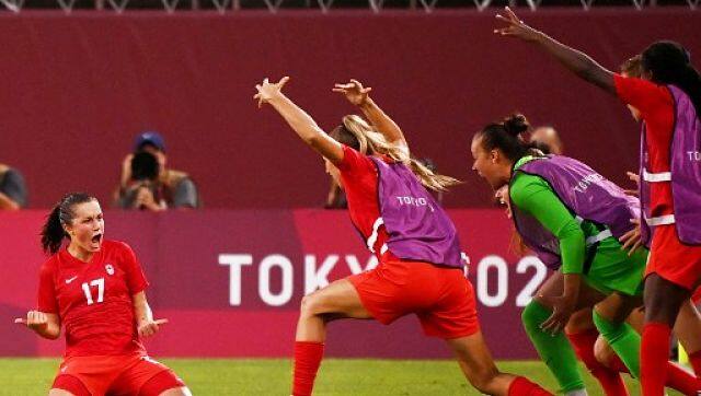 Players of the Canada women’s football team celebrate after winning the semi-final against USA 1-0 on Monday. AFP 