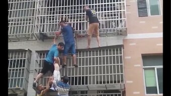 Watch: Six civilians form human chain to rescue kids trapped inside burning building in China