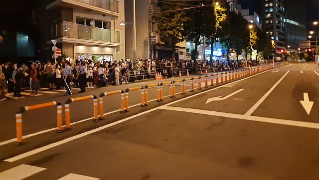 Locals in Tokyo lined up outside the Olympic stadium in Tokyo to see the glimpses of closing ceremony. Amit Kamath