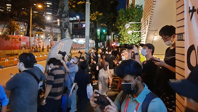 Locals in Tokyo lined up outside the Olympic stadium in Tokyo to see the glimpses of closing ceremony. Amit Kamath