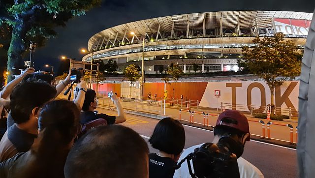 Tokyo Olympics 2020: Outside the Olympic Stadium, a watch party on the road for Closing Ceremony fireworks