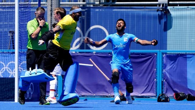 Manpreet Singh and PR Sreejesh celebrate India’s win in the bronze medal playoff against Germany. Image: AP