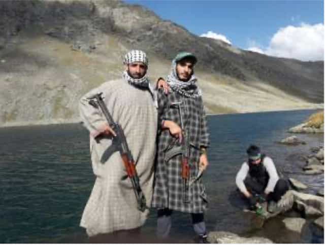 Abdul Mateen, aka Abu Waqas posing with teenager Fardeen Khandey (to his right)