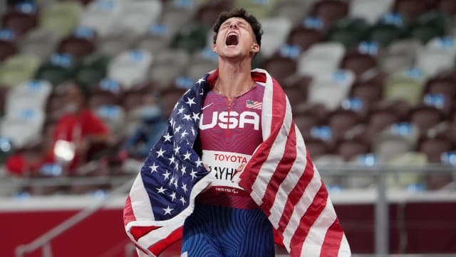 United States' Nick Mayhugh celebrates after winning the men's 100m T37 final at Tokyo 2020 Paralympic Games, Friday, Aug. 27, 2021, in Tokyo, Japan. (AP Photo/Eugene Hoshiko)