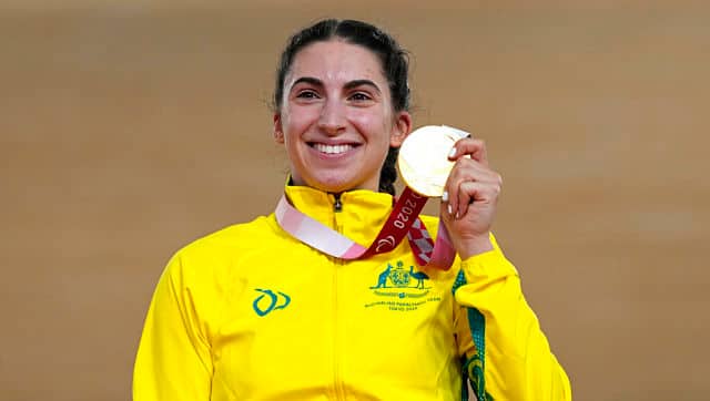Paige Greco of Australia holds her gold medal after winning the Cycling Track Women’s C1-3 3000m Individual Pursuit at the Tokyo 2020 Paralympic Games on Wednesday. Greco had the honour of winning the first gold of the Games. Greco smashed her own world record by nearly eight seconds in the heats and lowered it by another second and a half to 3min 50.815sec in the final. AP Photo