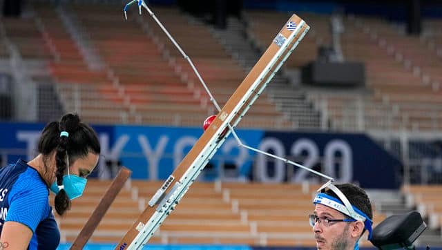 Greece's Grigorios Polychronidis launches a ball from ramp, using a releaser mounted on his headgear, as he competes against Japan's Kazuki Takahashi in a boccia individual BC3 pool match at the Tokyo 2020 Paralympic Games. AP Photo