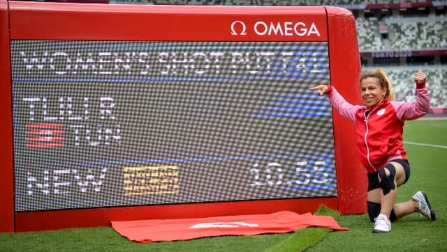 Raoua Tlili TUN next to the digital scoreboard showing her World Record and winning throw in the Women's Shot Put F41 at The Olympic Stadium. Tokyo 2020 Paralympic Games, Tokyo, Japan, Friday 27 August 2021. Photo: OIS/Joel Marklund. Handout image supplied by OIS/IOC