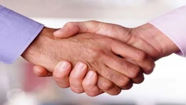 COVID-19: To shake hands or not? Age-old gesture in limbo as US businesses, public spaces reopen