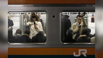 Man who stabbed at least 10 people on Tokyo train for 'looking happy' arrested